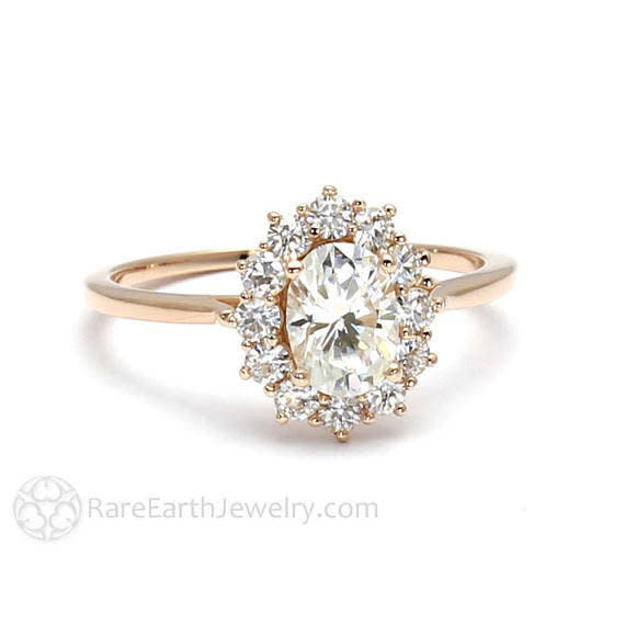 <i><a href="https://www.etsy.com/listing/194958365/18k-cluster-moissanite-engagement-ring?ga_search_query=moissanite&amp;ref=shop_items_search_1" target="_blank">Buy it from RareEarth on Etsy</a> for&nbsp;$1,195.</i>