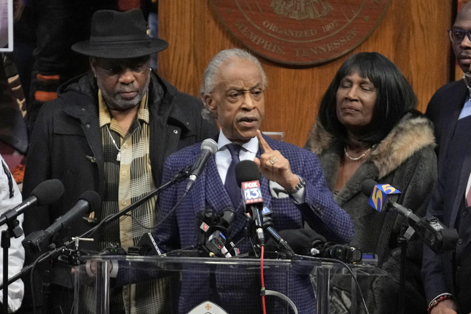 The Rev. Al Sharpton speaks at historic Mason Temple as he is flanked by RowVaughn Wells, right, mother of Tyre Nichols, and Tyre's stepfather Rodney Wells, left, during a news conference about the death of Tyre Nichols, Tuesday, Jan. 31, 2023, in Memphis, Tenn. A funeral service for Nichols, who died after being beaten by Memphis police officers, is scheduled to be held on Wednesday. (AP Photo/Jeff Roberson)