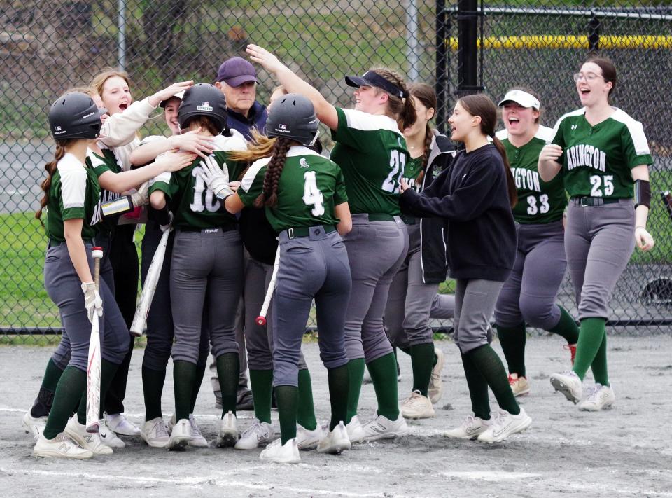 Brenna Howley is greeted by her Abington teammates after her inside the park home run against East Bridgewater on Tuesday, April 30, 2024.