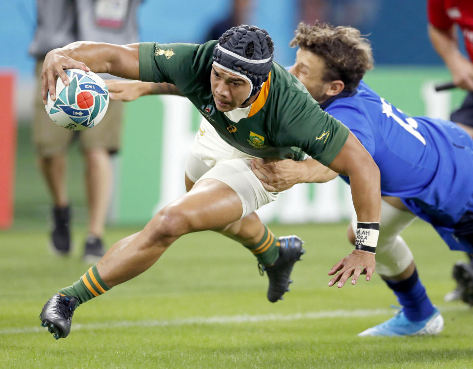 South Africa's Cheslin Kolbe scores a try during the Rugby World Cup Pool B game at Shizuoka Stadium Ecopa between South Africa and Italy, in Shizuoka, Japan, Friday, Oct. 4, 2019. (Kyodo News via AP)