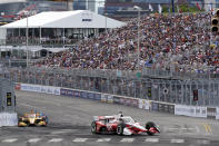 Scott McLaughlin (3) comes through a turn during the Music City Grand Prix auto race Sunday, Aug. 7, 2022, in Nashville, Tenn. (AP Photo/Mark Humphrey)