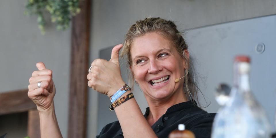 Chef Amanda Frietag gives the crowd thumbs up as she prepares to do a cooking demonstration on the Better in the Bluegrass stage at Bourbon and Beyond on Sept. 22, 2019. 