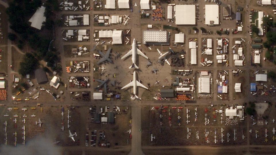 C-17, KC-135, MV-22, F-15E, F-15C, T-1, A-10, T-38s and more share the central 'plaza' static ramp with a 747 LCA, A350, and NASA's Super Guppy. (<em>PHOTO © 2023 PLANET LABS INC. ALL RIGHTS RESERVED. REPRINTED BY PERMISSION</em>) 