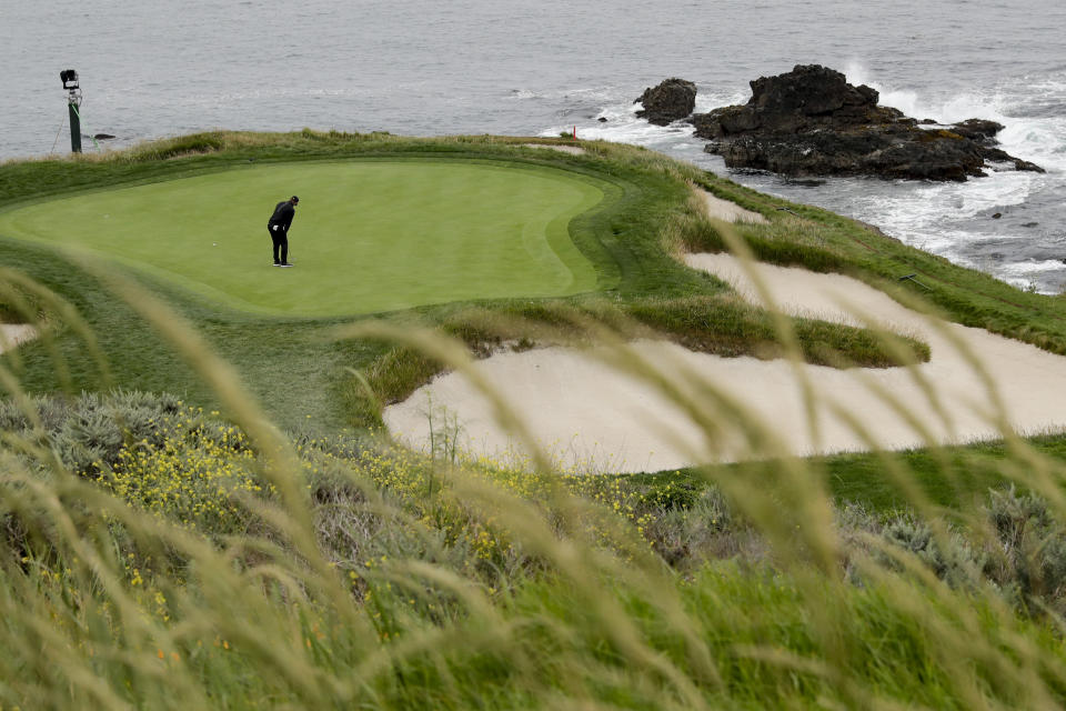 Gary Woodland putts on the seventh hole during the second round of the U.S. Open Championship golf tournament Friday, June 14, 2019, in Pebble Beach, Calif. (AP Photo/Matt York)