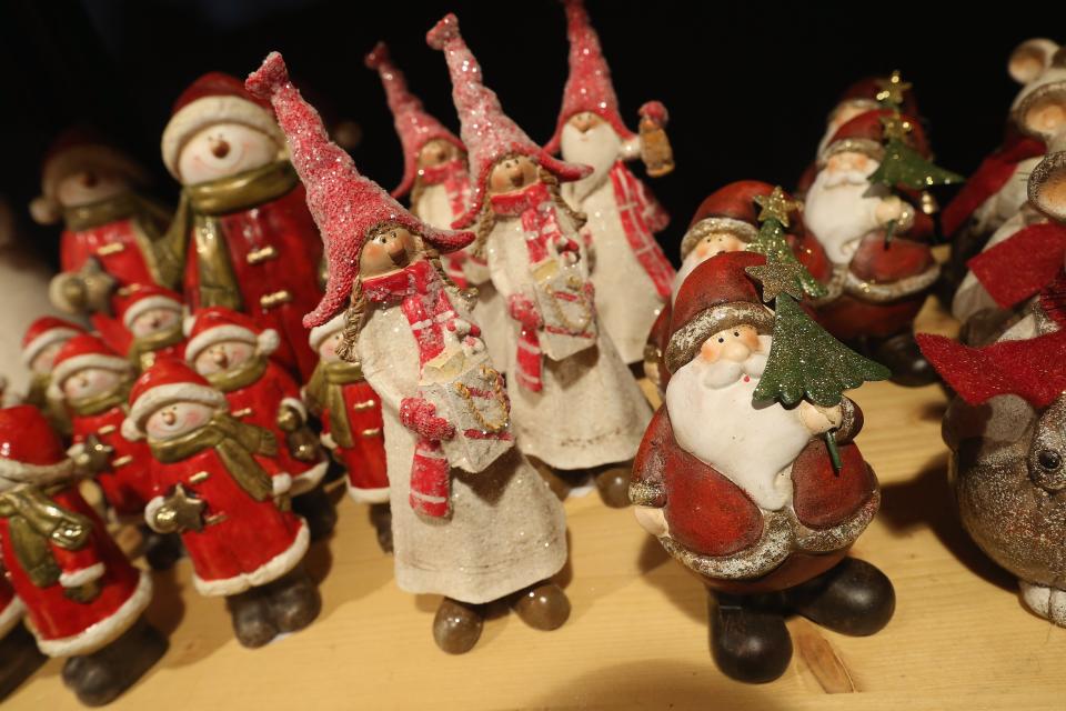 BERLIN, GERMANY - NOVEMBER 26: Christmas decorations hang for sale at the Kaethe Wohlfahrt stand at the annual Christmas market at Gendarmenmarkt on its opening day on November 26, 2012 in Berlin, Germany. Christmas markets, with their stalls selling mulled wine, Christmas tree decorations and other delights, are an integral part of German Christmas tradition, and many of them opened across Germany today. (Photo by Sean Gallup/Getty Images)