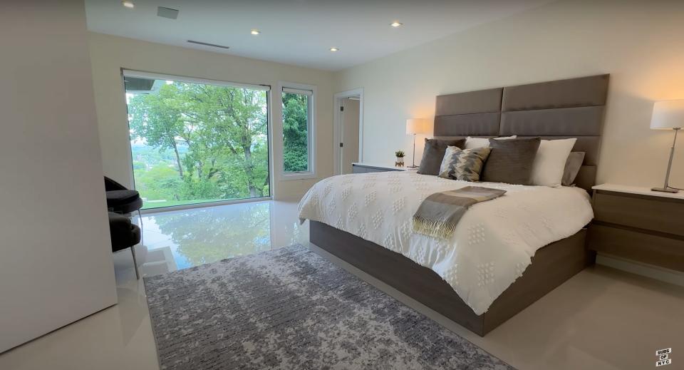 A second-floor guest bedroom in Aaron Rodgers' New Jersey home.