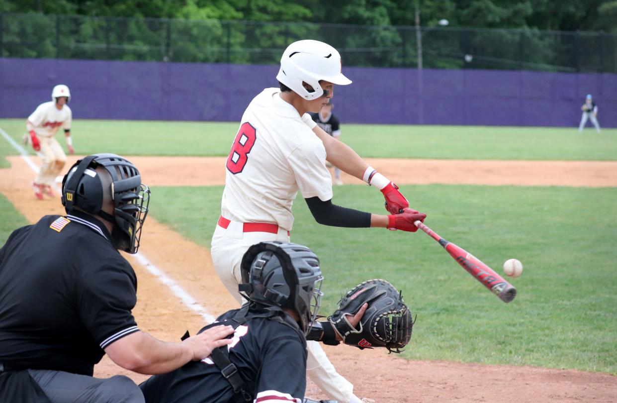 Tyler Durkin from Roy C. Ketcham connects for a hit against Elmira High School in the boys baseball Class AA Regional Final game at John Jay High School in Cross River, June 3, 2023. Ketcham beat Elmira, 12-1 in 5 innings.