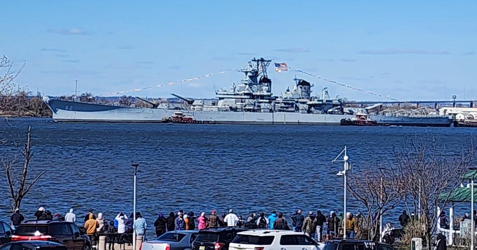 Spectators line the shore at RiverWinds in West Deptford to see the Battleship New Jersey.