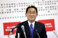 Japan's Prime Minister and ruling Liberal Democratic Party leader Fumio Kishida smiles as he joins a live interview with news channels after Japan's general election, in Tokyo