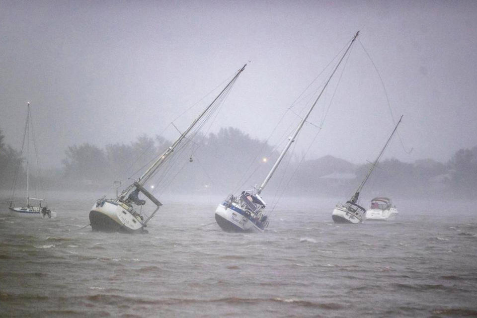 Sailboats anchored in Roberts Bay are blown around by 50 mph winds in Venice, Florida, on Sept. 28, 2022.
