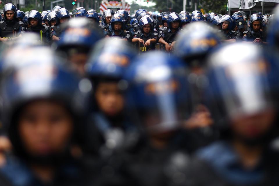 <p>Philippine riot police stand guard during a protest against US President Donald Trump ahead of the 31st Association of Southeast Asian Nations (ASEAN) Summit in Manila on Nov. 11, 2017. (Photo: Manan Vatsyayana/AFP/Getty Images) </p>