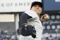 New York Yankees' Anthony Rizzo throws the ball to fans during the first inning of a baseball game against the Baltimore Orioles, Monday, Aug. 2, 2021, in New York. (AP Photo/Mary Altaffer)