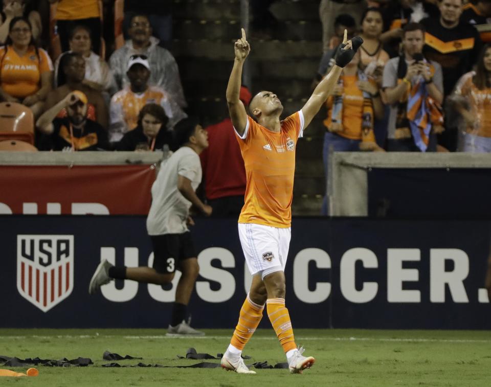 Houston Dynamo's Mauro Manotas celebrates his goal during the first half of the U.S. Open Cup championship soccer match against the Philadelphia Union Wednesday, Sept. 26, 2018, in Houston. (AP Photo/David J. Phillip)