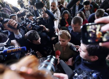 Ukrainian presidential candidate Yulia Tymoshenko (C) speaks to journalists during a news conference in Donetsk April 18, 2014. REUTERS/Alexander Prokopenko/Pool