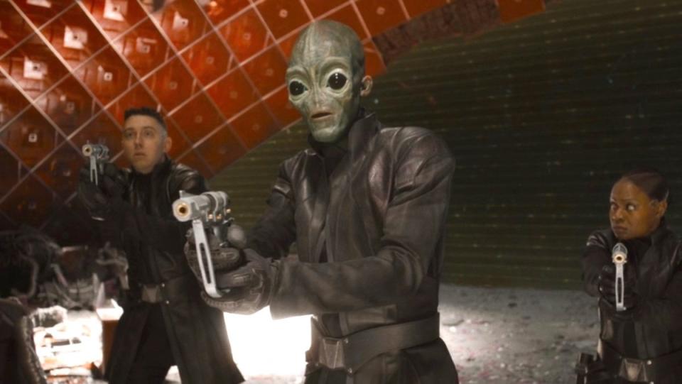 A green alien holding a gun in Guardians of the Galaxy Vol. 3