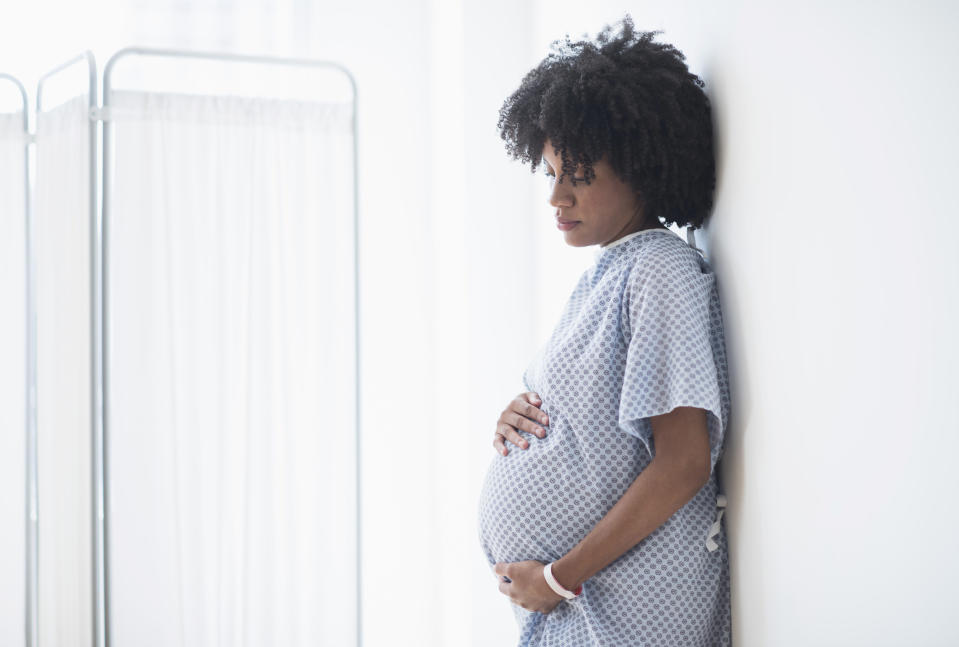 a woman holding her belly