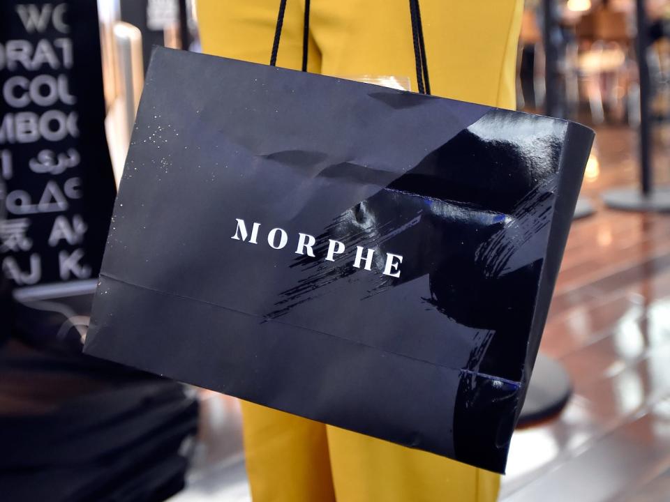 A shopper carries a Morphe bag at the brand's Las Vegas, Nevada, store on June 16, 2018.