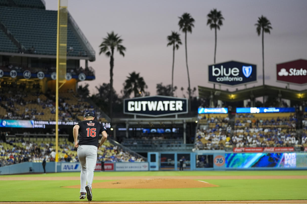 Cleveland Guardians starting pitcher Matthew Boyd runs to the mound during the first inning of a baseball game against the Los Angeles Dodgers in Los Angeles, Friday, Sept. 6, 2024. (AP Photo/Ashley Landis)