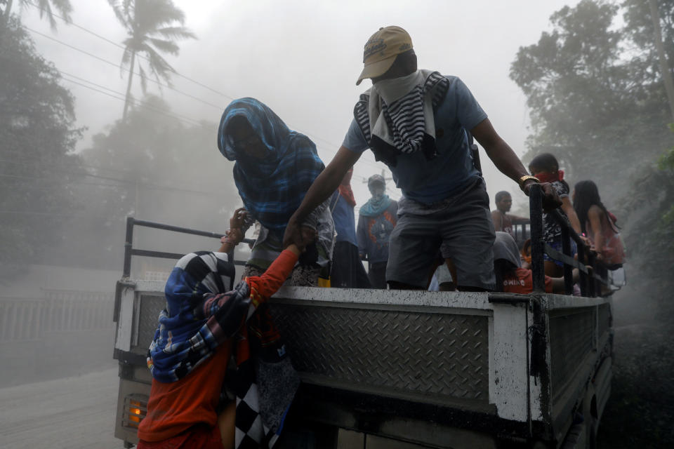 Residents living near the erupting Taal Volcano evacuate from Lemery, Batangas, Philippines, January 13, 2020. (Reuters)