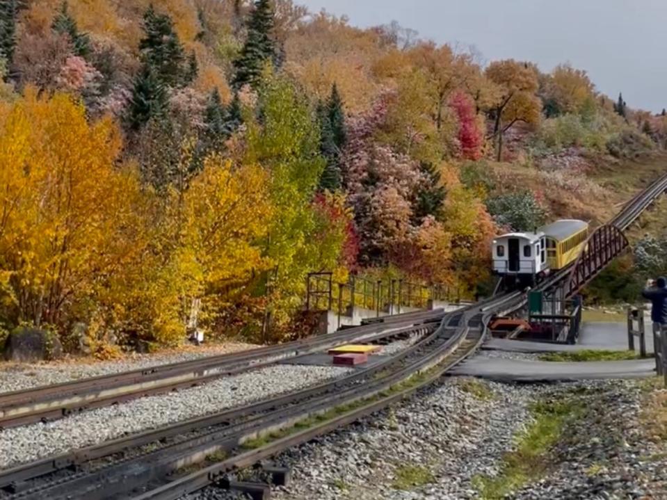 Train traveling down train tracks in New Hampshire's White Mountains