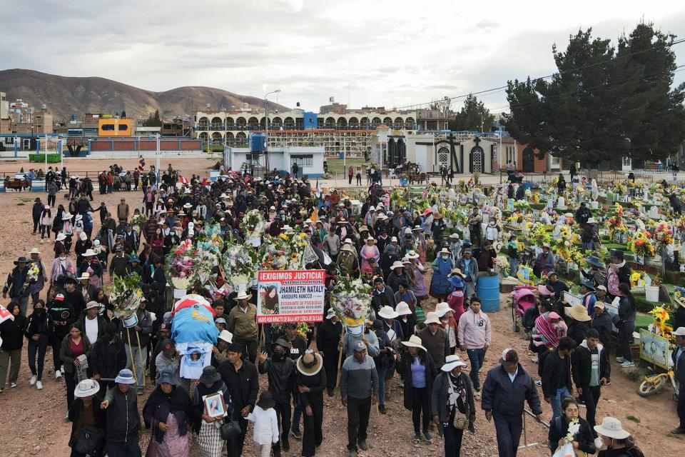 Relatives and friends attend the burial of 17-year-old student Jamilath Aroquipa, one of the 17 people killed during the violent attempt to take over the airport of the city of Juliaca several days earlier, at the Capilla cemetery in Juliaca, southern Peru, January 12, 2023. / Credit: JUAN CARLOS CISNEROS/AFP/Getty