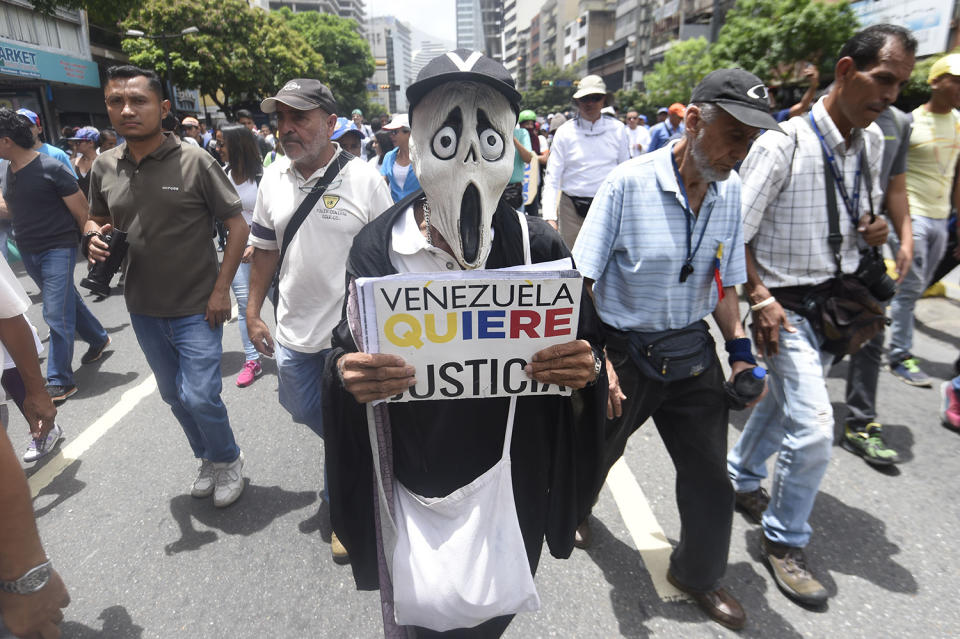 Opposition activists march in Caracas