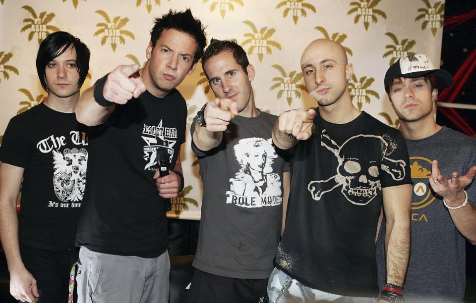 <div class="inline-image__caption"><p>Simple Plan point to the future, Feb. 2, 2005, in Bangkok, Thailand. </p></div> <div class="inline-image__credit">MJ Kim/Getty</div>