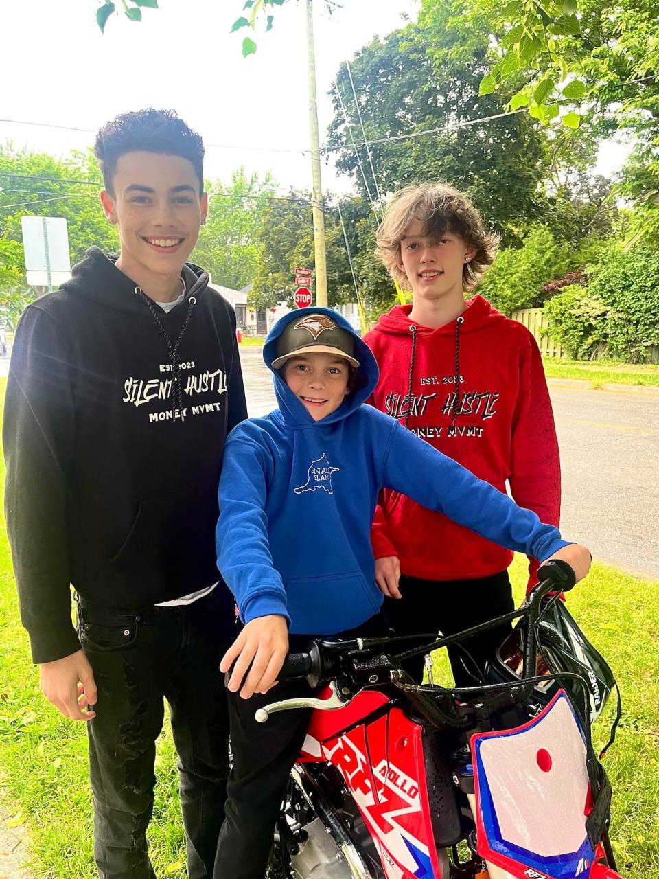 Eli with his brothers Keirron (left) and Liam (right) on the dirt bike they gifted him last year. He had an accident on the bike which punctured his abdomen. During the treatment, doctors found a tumour which later turned out to be a rare form of cancer. 