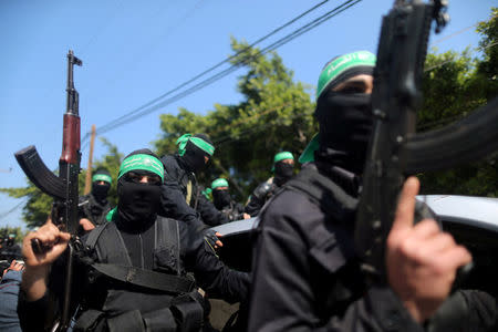 FILE PHOTO - Palestinian members of Hamas's armed wing take part in the funeral of a senior militant in Gaza City March 25, 2017. REUTERS/Mohammed Salem/File Photo