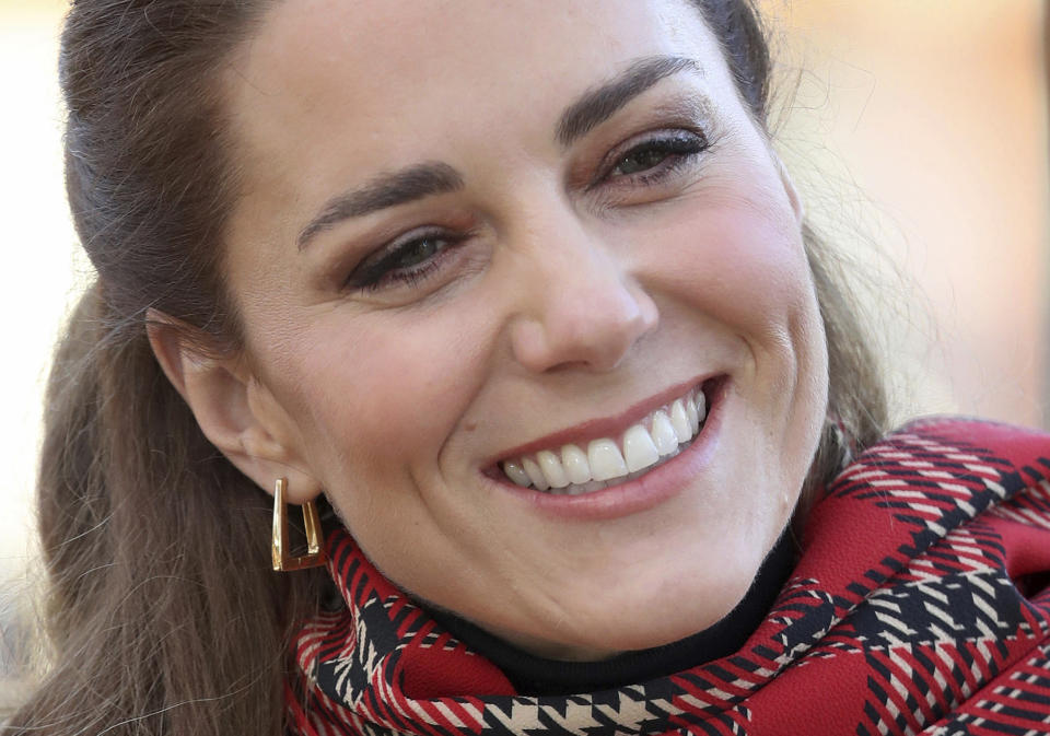 Britain's Kate Duchess of Cambridge talks to members of the public at Cardiff Castle on Tuesday Dec. 8, 2020, in Cardiff, Wales. Prince William and Kate Duchess of Cambridge are undertaking a short tour of the UK by train ahead of the Christmas holidays to pay tribute to the inspiring work in local communities. (Chris Jackson/Pool via AP)