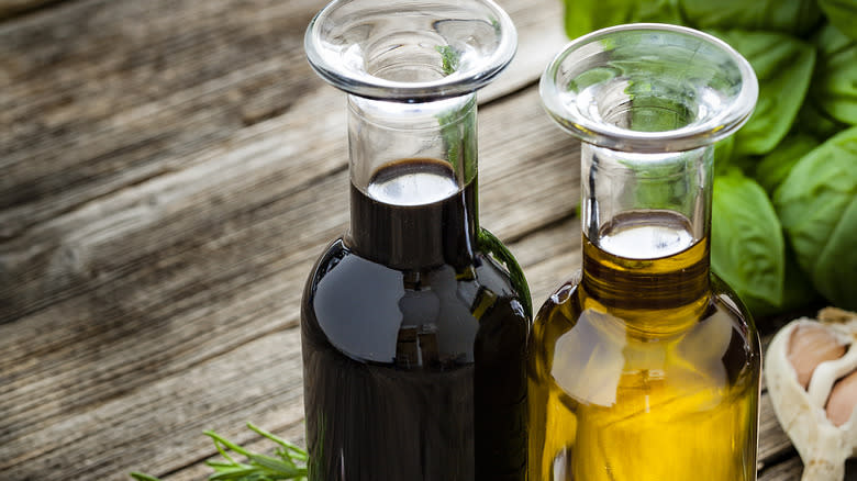 glass bottles of olive oil and vinegar