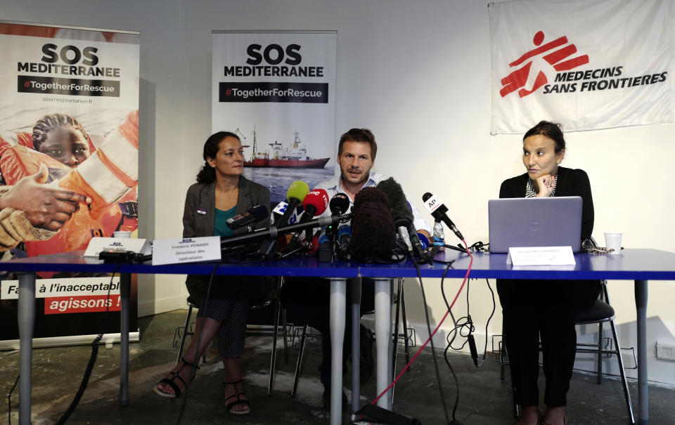 Sophie Beau, left, general director of SOS Mediterranee France, Frederic Penard, operations director for SOS Mediterranee, and Hassiba Hadj Sahraoui, from Doctors without Borders group, answer reporters Tuesday, Aug.14, 2018 in Paris. Portugal has become the first European country to say it could take in some migrants aboard rescue ship Aquarius, operated by French groups, as officials in coastal France made impassioned pleas to a so-far-silent French government to allow its docking. (AP Photo/Michel Spingler)