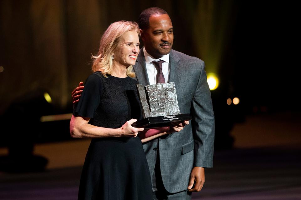 Kerry Kennedy is presented with the Freedom Award by Jason Campbell, vice president of operations and ops system support at FedEx, during the Freedom Award ceremony at The Orpheum in Downtown Memphis, on Thursday, October 19, 2023.