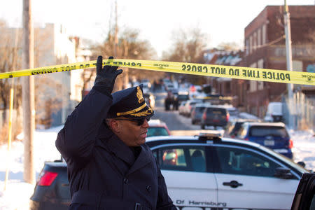 Deputy Chief Deric Moody leaves the crime scene following officer-involved shooting in Harrisburg, Pennsylvania, U.S., January 18, 2018. REUTERS/Daniel Shanken