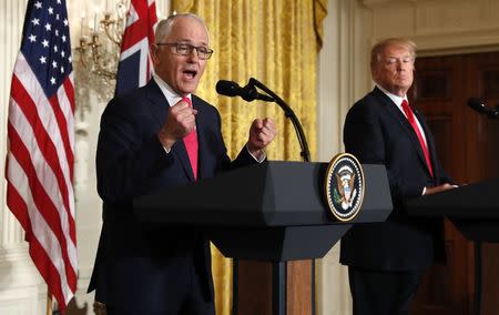 U.S. President Donald Trump (R) listens as Australian Prime Minister Malcolm Turnbull speaks during their joint news conference at the White House in Washington, U.S., February 23, 2018. REUTERS/Kevin Lamarque