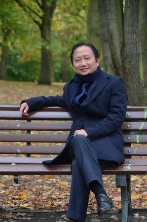 Trinh Xuan Thanh, a former official at state oil company PetroVietnam, sits on a park bench in Berlin in this undated photo. REUTERS/dpa/picture alliance