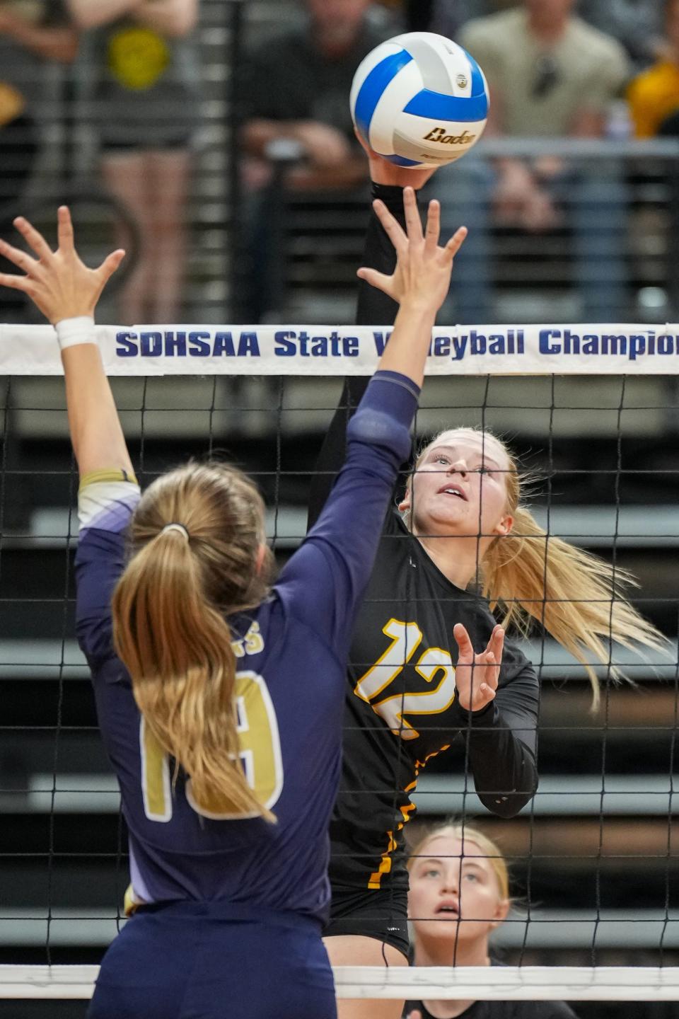 Wolsey-Wessington's Kailynn Dorris hits against Gayville-Volin's Kaden Bye (19) during a Class B consolation semifinal match in the state high school volleyball tournament on Friday, Nov. 17, 2023 in the Summit Arena at The Monument in Rapid City.