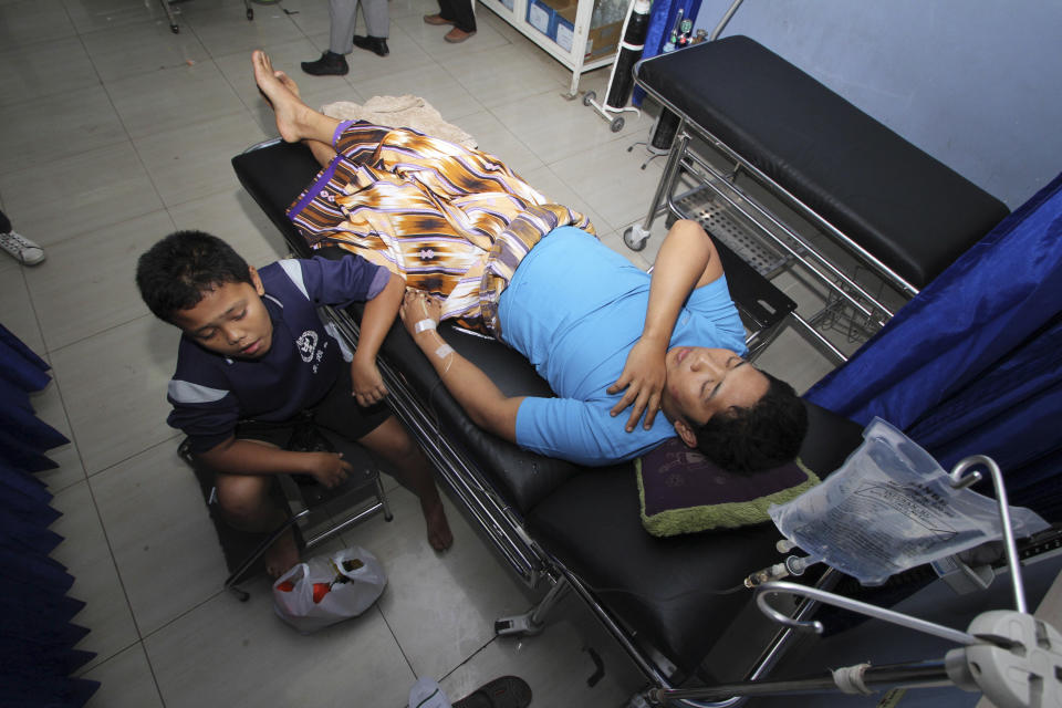 Survivors of a ferry accident on Sunda straits receive medical treatment at a hospital in Cilegon, Banten province, Indonesia, Wednesday, Sept. 26, 2012. A passenger ferry collided with a cargo ship and sank west of Indonesia's main island Wednesday morning, and at least eight people were killed, officials said. (AP Photo)