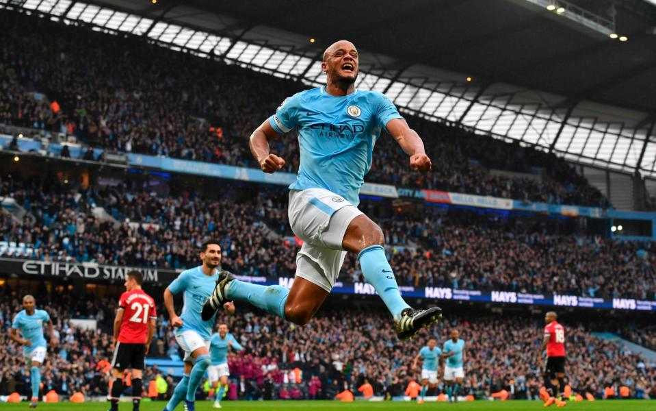 Taken on April 7, 2018 Manchester City's Belgian defender Vincent Kompany celebrates scoring the opening goal during the English Premier League football match between Manchester City and Manchester United at the Etihad Stadium in Manchester, north west England. - GETTY IMAGES