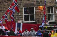 Spectators follow the men elite race, at the road cycling World Championships in Harrogate, England, Sunday, Sept. 29, 2019. (AP Photo/Manu Fernandez)