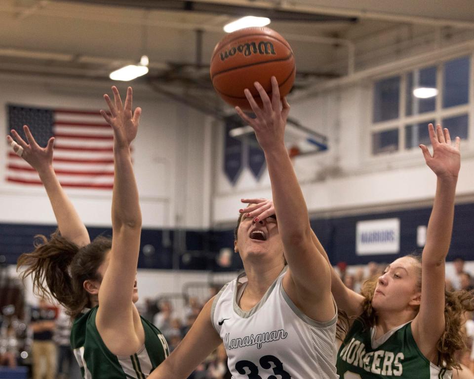 Manasquan Mary Elizabeth Donnelly tries to shoot blind as she has her eyes covered. Manasquan Girls Basketball vs New Providence in Central Jersey Group 2 Sectional in Manasquan, NJ on March 8, 2022. 