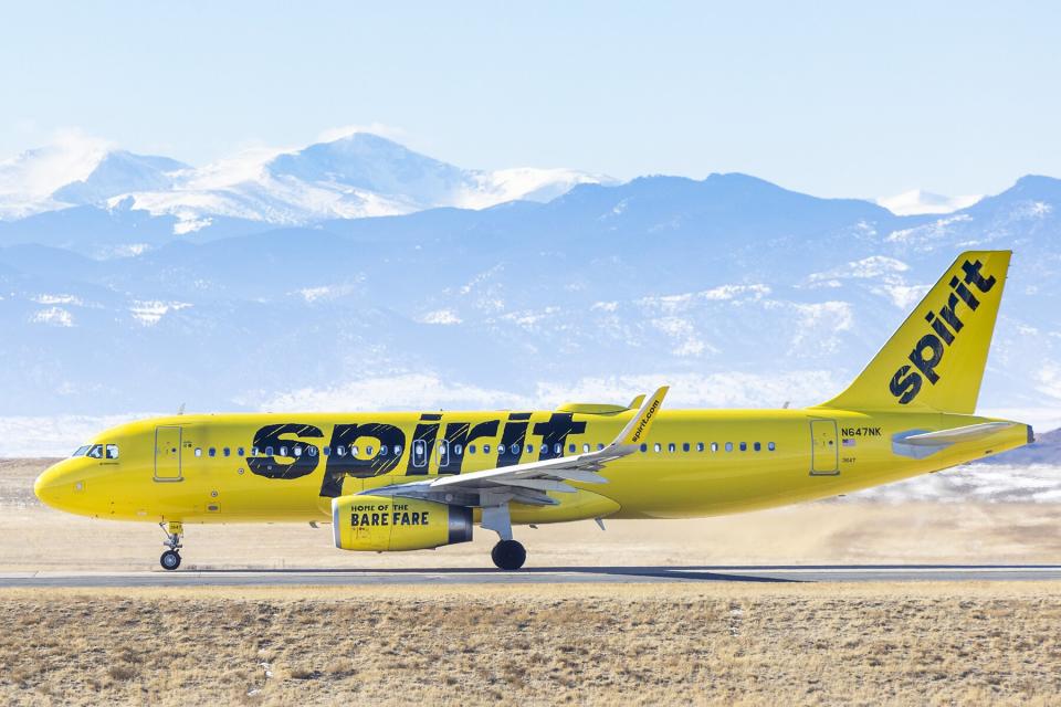 A Spirit Airlines airplane taxis for takeoff at Denver International Airport in Denver, Colorado,