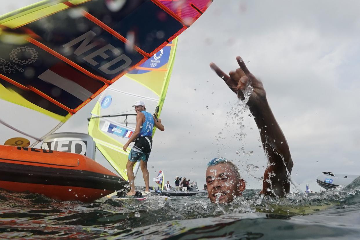 Kiran Badloe, from The Netherlands, celebrates after placing first in the men's windsurfer medal race at the 2020 Summer Olympics, Saturday, July 31, 2021, in Fujisawa, Japan.