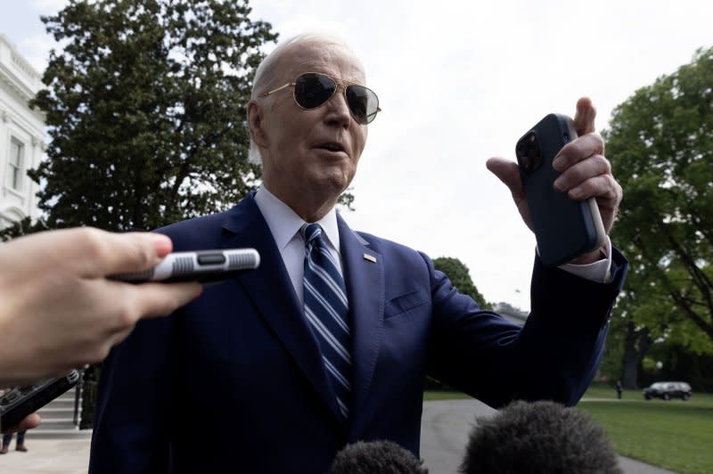 President Joe Biden speaks to members of the news media before departing by Marine One on the South Lawn of the White House in Washington, D.C., on Thursday while on his way to Syracuse, N.Y., to deliver remarks on the CHIPS and Science Act and his economic agenda. Photo by Michael Reynolds/UPI