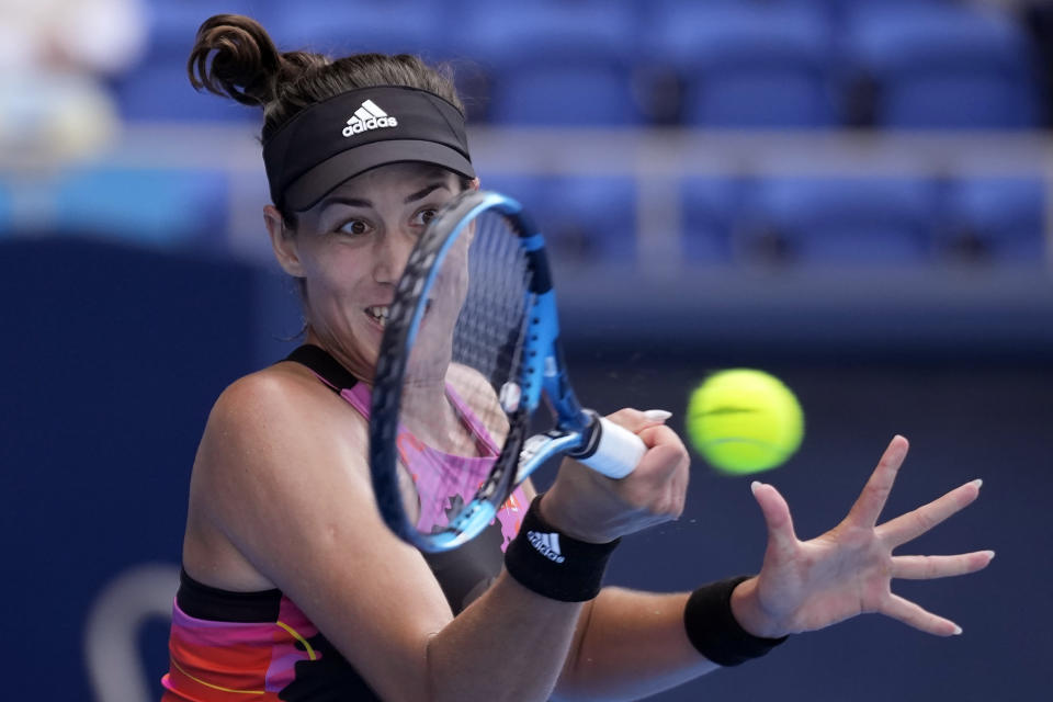 Garbine Muguruza of Spain returns a shot against Despina Papamichail of Greece during a singles match in the Pan Pacific Open tennis tournament at Ariake Colosseum Wednesday, Sept. 21, 2022, in Tokyo. (AP Photo/Eugene Hoshiko)