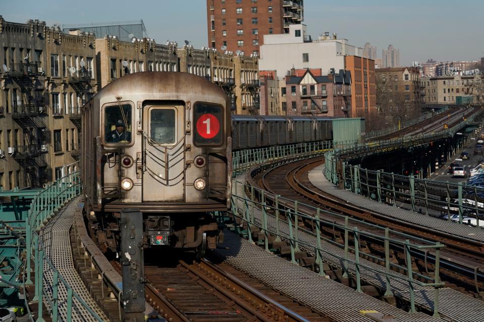 A subway train pulls into a station in New York, Monday, Feb. 21, 2022.