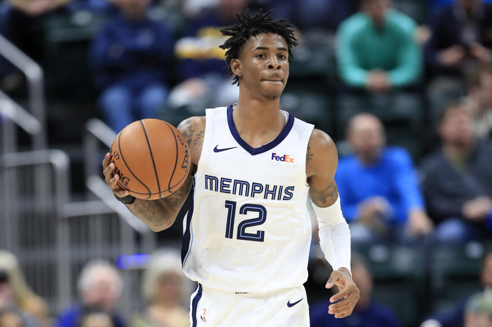 Ja Morant #12 of the Memphis Grizzlies dribbles the ball against the Indiana Pacers 