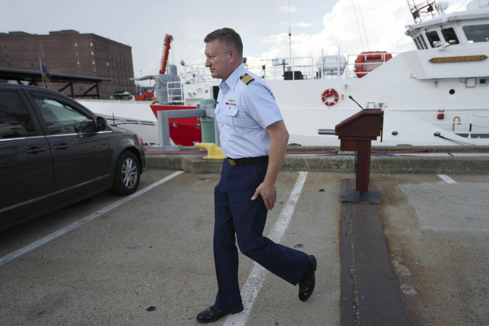 Capt. Jason Neubauer, chief investigator, U.S. Coast, steps away from a podium following a news conference, Sunday, June 25, 2023, at Coast Guard Base Boston, in Boston. The U.S. Coast Guard said it is leading an investigation into the loss of the Titan submersible that was carrying five people to the Titanic, to determine what caused it to implode. (AP Photo/Steven Senne)