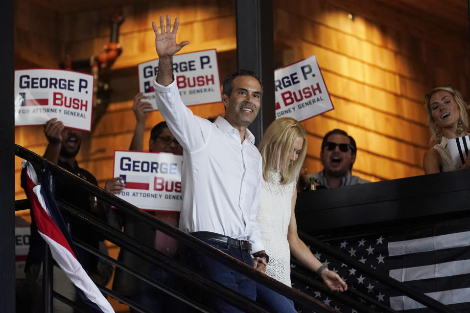 Texas Land Commissioner George P. Bush arrives for a kick-off rally with his wife Amanda to announced he will run for Texas Attorney General, Wednesday, June 2, 2021, in Austin, Texas. (AP Photo/Eric Gay)