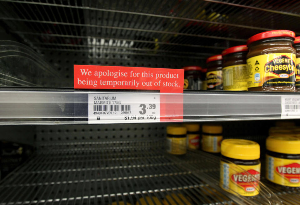 A sign alerting customers that a product is out of stock is placed in front of an empty shelve where Marmite is usually found at a supermarket in Auckland, New Zealand, Tuesday, March 20, 2012. The manufacturer, Sanitarium, announced this week it had run out of Marmite, the sticky black spread that fans adore and doubters think would be better used for axle grease. (AP Photo/New Zealand Herald, Sarah Ivey) NEW ZEALAND OUT, AUSTRALIA OUT